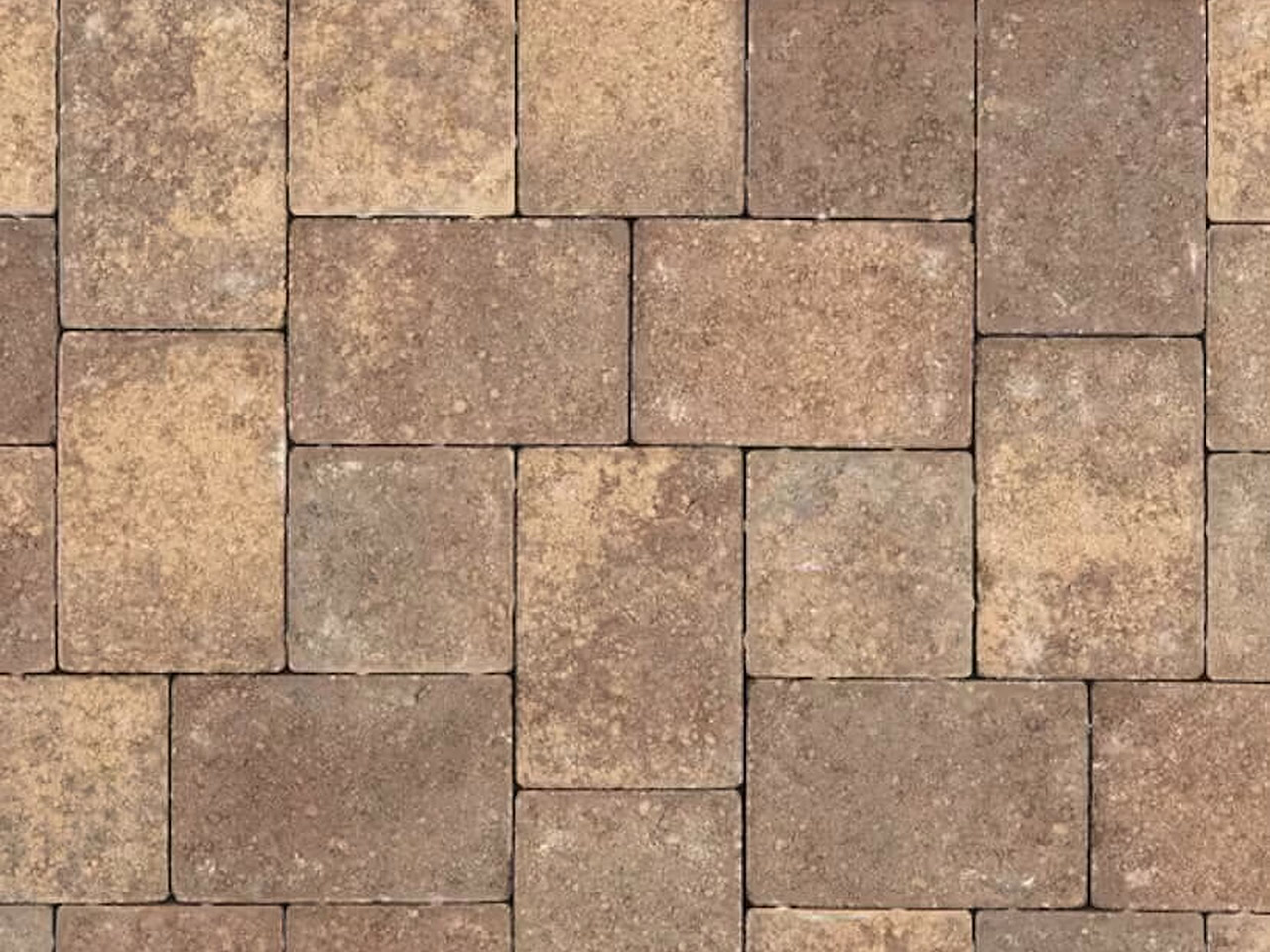 Tumbled brick pavers in tan, brown, and ocher tones set in a modular pattern for a Jupiter walkway